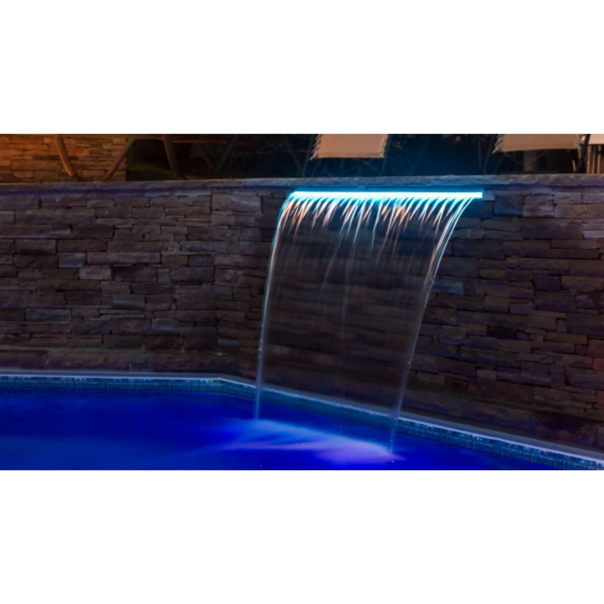 CMP Brilliant Wonders 36" LED Waterfall | 25677-330-000 showcasing illuminated waterfall in a pool with stone wall backdrop.