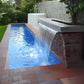 CMP Natural Wonders 72" x 6" Lip White Waterfall | 25577-630-000 cascading into a blue pool, showcasing a modern design.