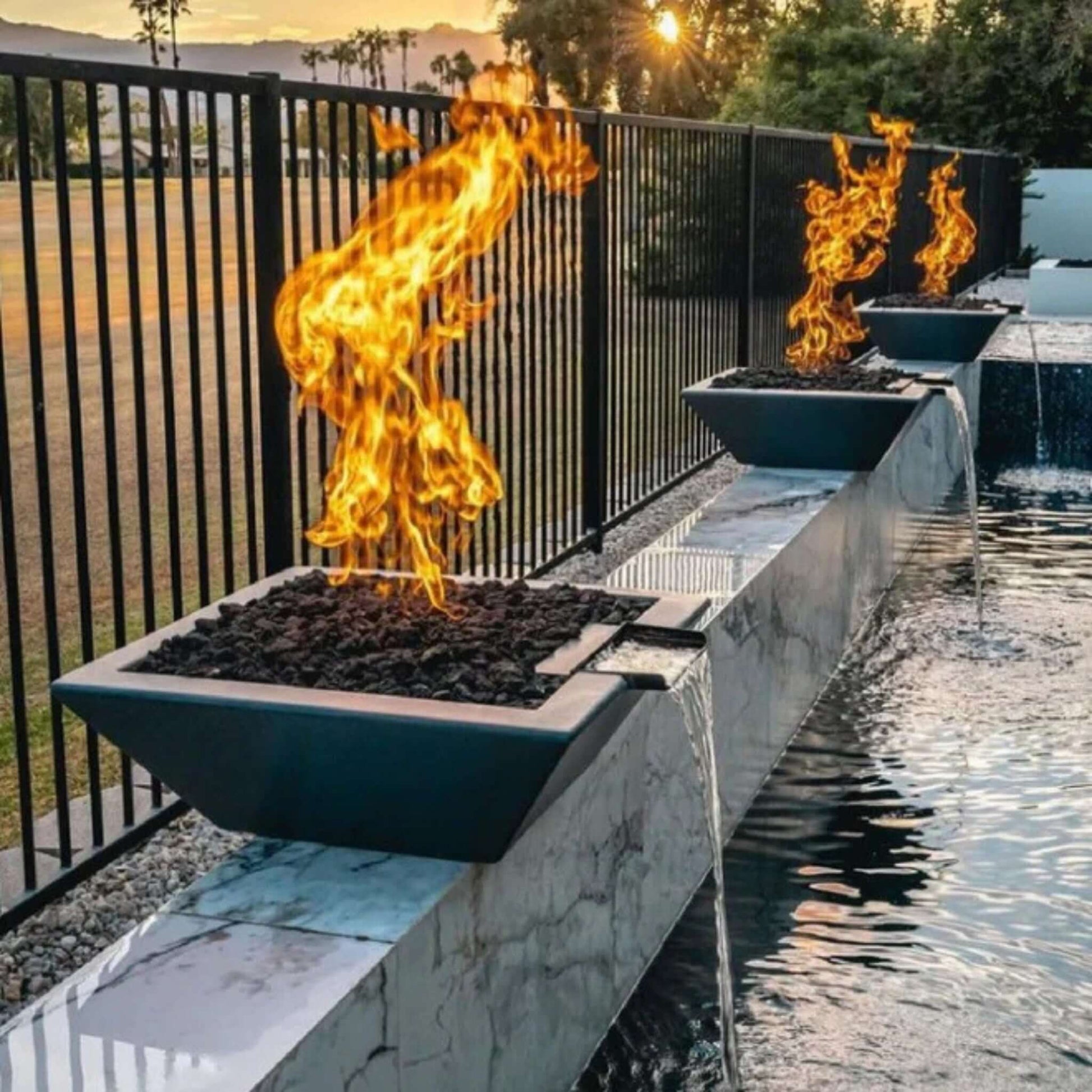 Grand Effects Fire & Water Bowl by SOS Pool, showcasing flames and water in an elegant outdoor setting.