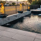 Luxurious pool with fire and water bowls at sunset featuring Grand Effects Corinthian Fire & Water Bowl by SOS Pool.