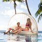 Couple relaxing on INTEX Canopy Island Inflatable Pool Float in the water, SKU 58292EP, perfect for SOS Pool experiences.