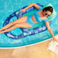 Woman relaxing on SwimWays Elite Spring Float Recliner in pool, SKU 6069308, for premium SOS Pool comfort.