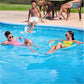 Family enjoying pool time with SwimWays Premium Spring Float Papasan, kids relax on floats while another splashes.