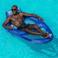 Man relaxing in SwimWays Spring Float Recliner XL in pool, enjoying luxury lounging, SKU 6069706, SOS Pool.