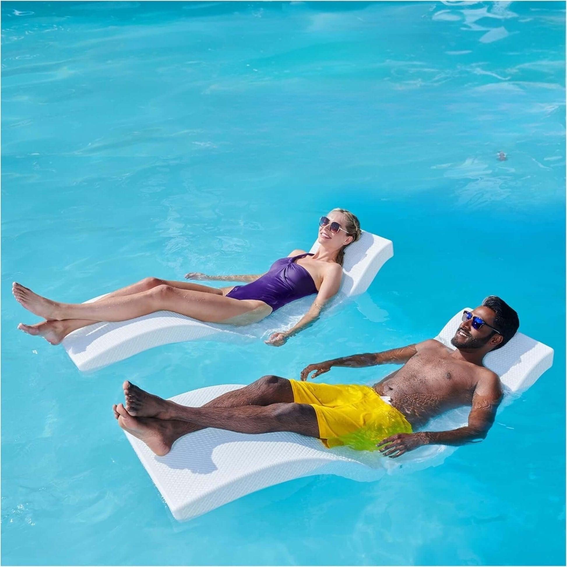 Two people relaxing on SwimWays Terra Sol Sonoma Pool Lounge in a pool, enjoying the SOS Pool experience. SKU: SOS-PB-123.