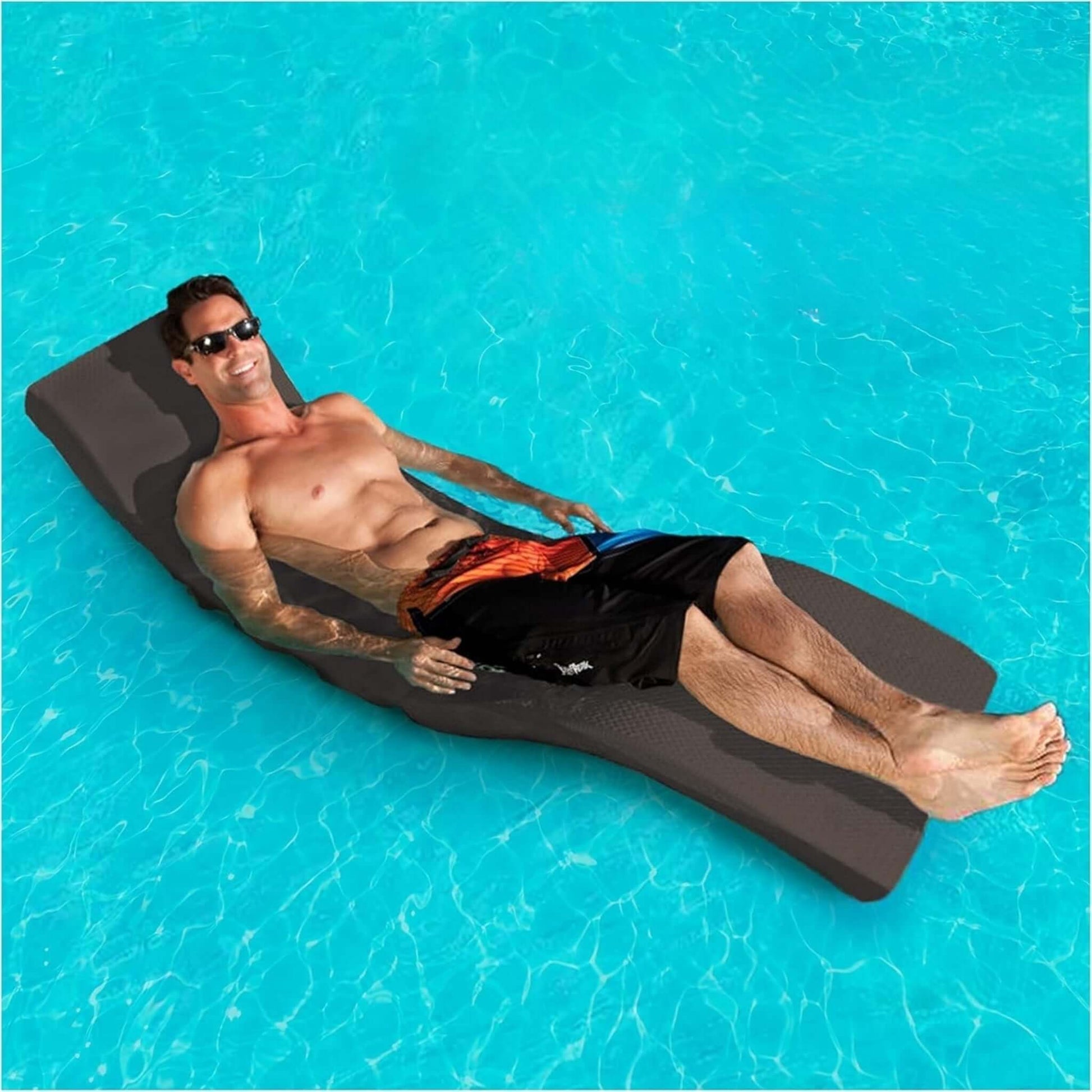 Man lounging on SwimWays Terra Sol Sonoma Pool Lounge in blue water. Ergonomic SOS Pool lounge chair, SKU: TerraSolSonoma