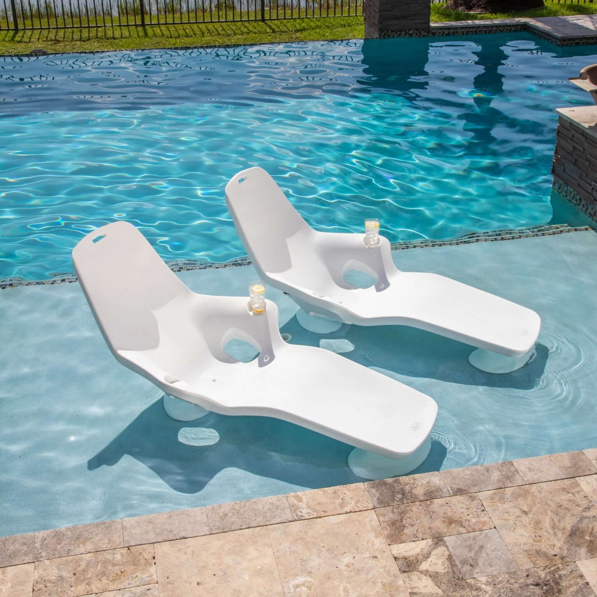 TenJam Shayz In-Pool Lounger 2 Pack, SOS Pool, UV-resistant loungers with cup holders in crystal clear water.