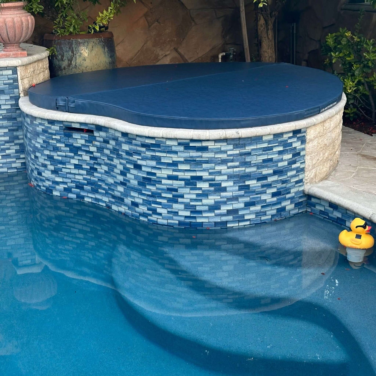 Custom spa and hot tub cover by SOS Pool, made to order with durable marine-grade vinyl and 4-mil vapor barrier.